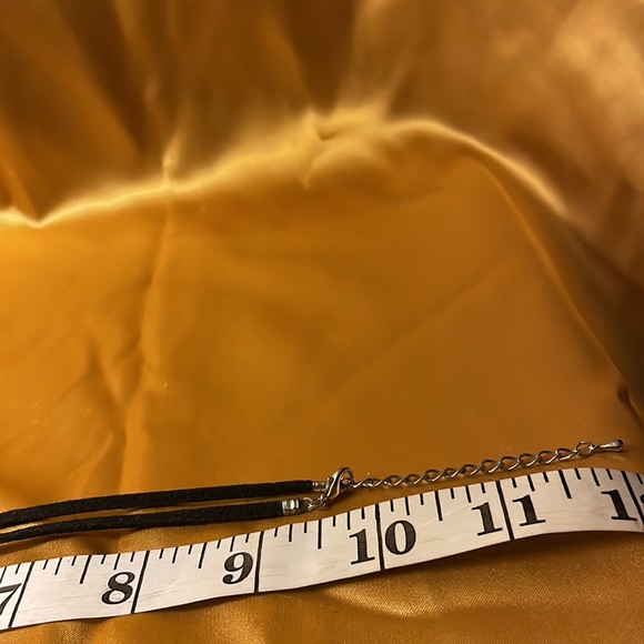 Gold and silver colored pendant on leather like cord strap - Picture 11 of 12